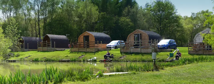 Springwood fisheries with pod style lodges around a fishing lake
