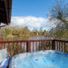 Otter Falls hot tub on decking overlooking the fishing lake