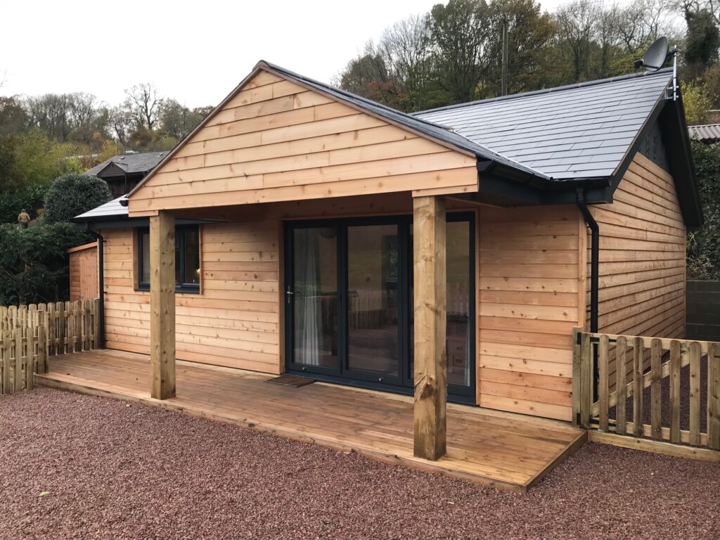 A wooden cabin on the bank of the River Severn