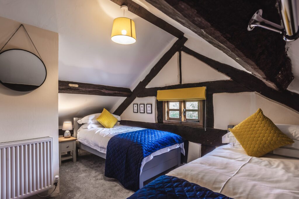 The bedrooms with pitched roof and oak beams