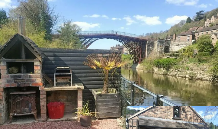 The old boat house garden a patio alongside the river with the Ironbridge in the background