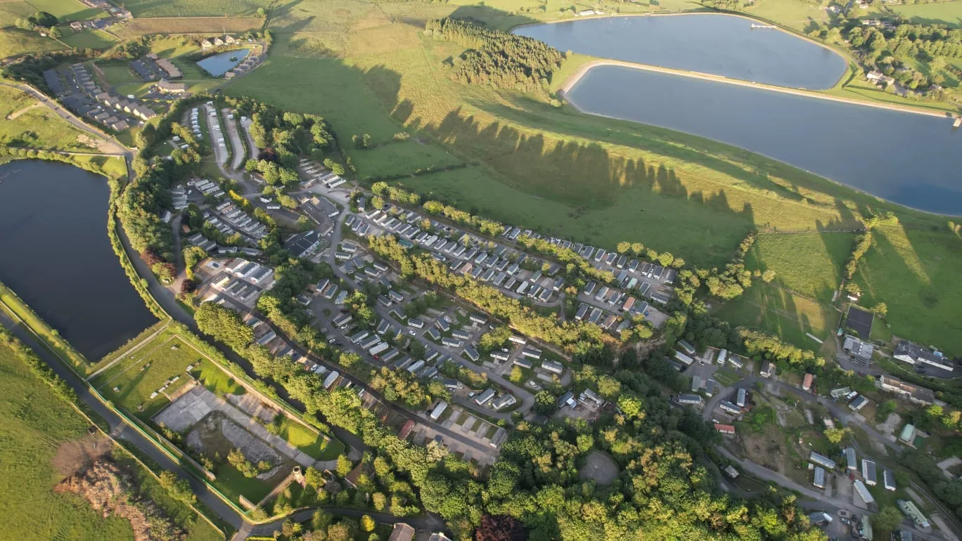 Aerial view of Beacon Fell View Holiday Park, Longridge, with lodges and reservoirs