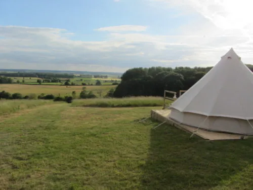 Bell tent on a decked base overlooking open countryside at Hunters Lodge, Lincolnshire
