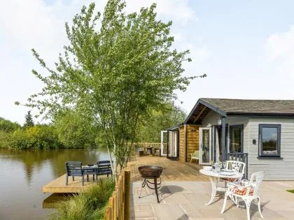 Lakeside lodge at Ludlow Lodges with a patio and private decked peg over the lake
