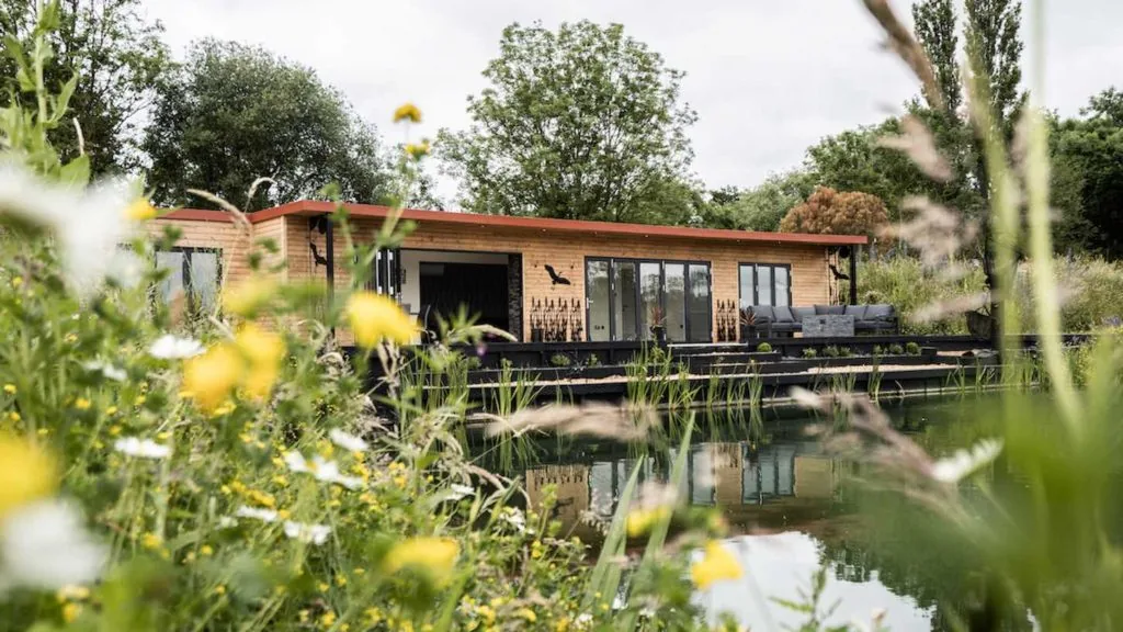 Lakeside lodge with decking and a private peg at S&R Fisheries, Lincolnshire