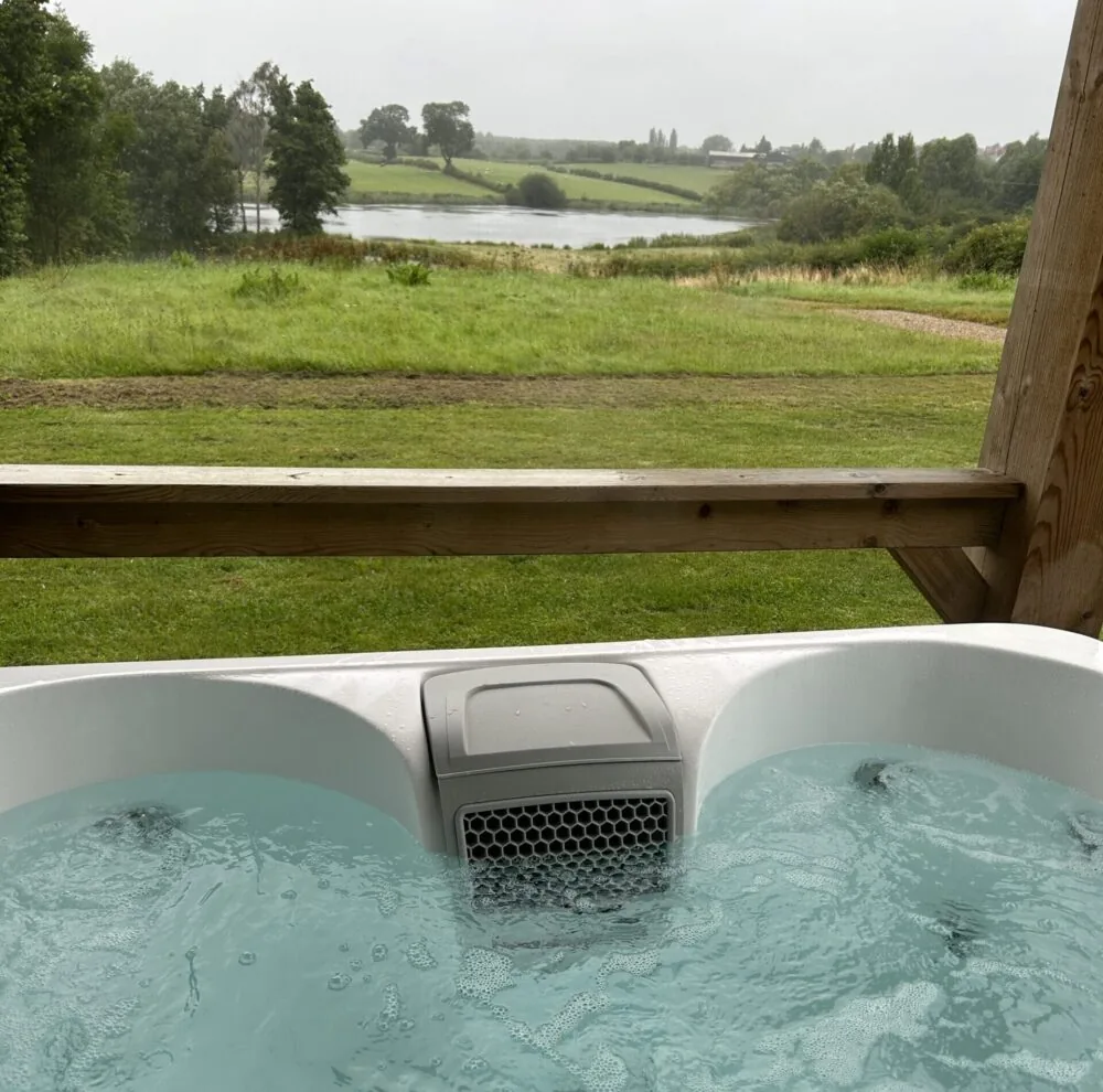 View across the fishing lake from the hot tub at Steam Mill Lodges, Derbyshire