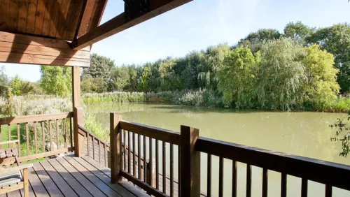 Lodge decking used as a private fishing peg overlooking the lake at Waterside Fishing Lodges, Spilsby